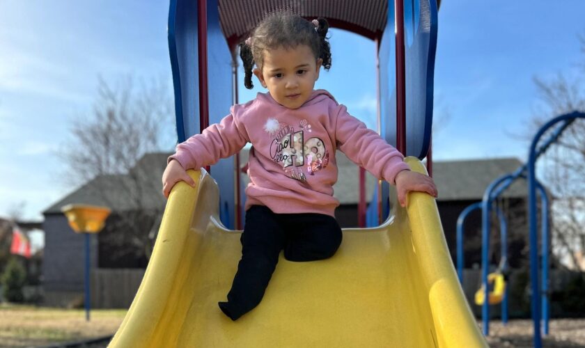 Rafah plays in the park near her new home in Missouri