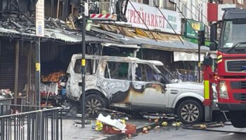 Flats catch fire after car rammed into Birmingham shop in suspected arson attack