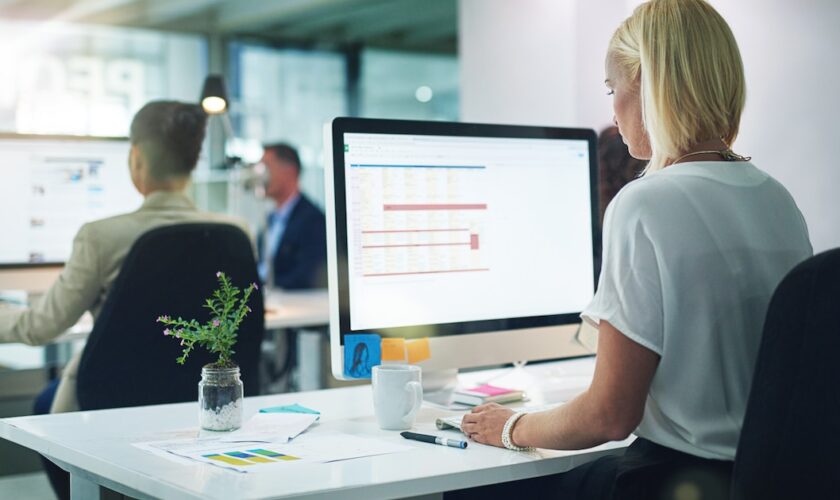 Cropped shot of a group of businesspeople working in the office