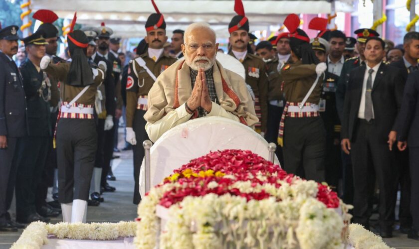 India's Prime Minister Narendra Modi pays his last respects to Mr Singh