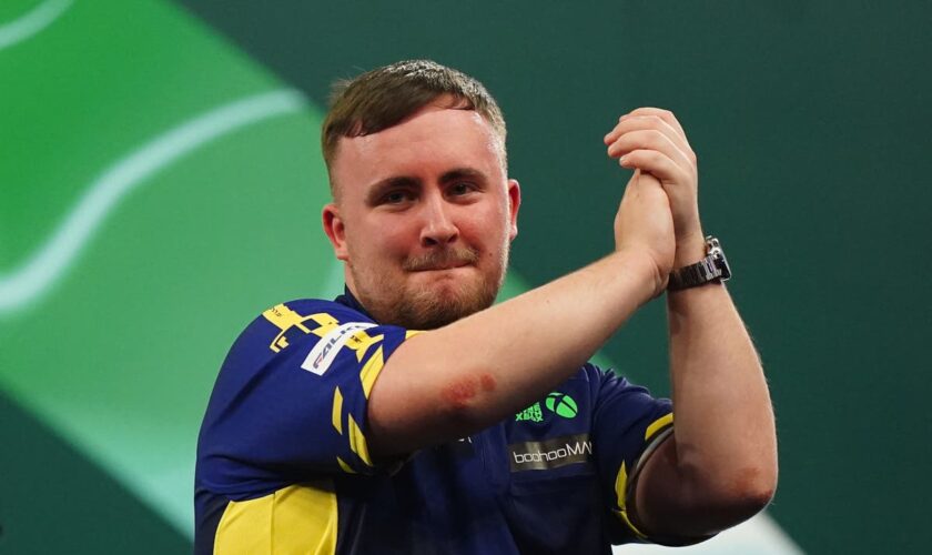 Luke Littler overcomes sticky start to beat Ian White and reach PDC World Championships last 16