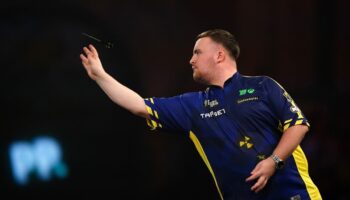 Luke Littler overcomes slow start to progress at World Darts Championship