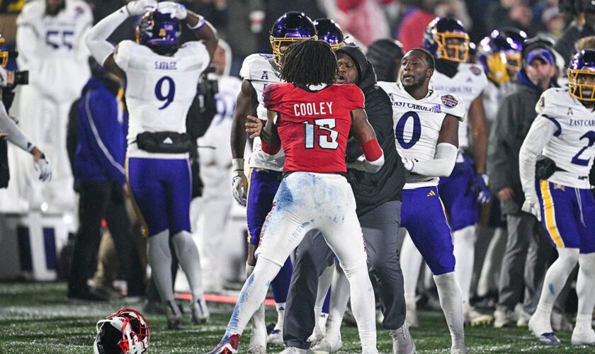 East Carolina-NC State fight mars end of Military Bowl, ref left bloodied