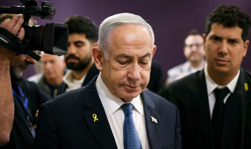 Israeli Prime Minister Benjamin Netanyahu attends his trial on corruption charges at the district court in Tel Aviv, Israel, Monday, Dec. 16, 2024. (Stoyan Nenov/Pool Photo via AP)