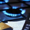 bank cards and a calculator on the background of a burning plate