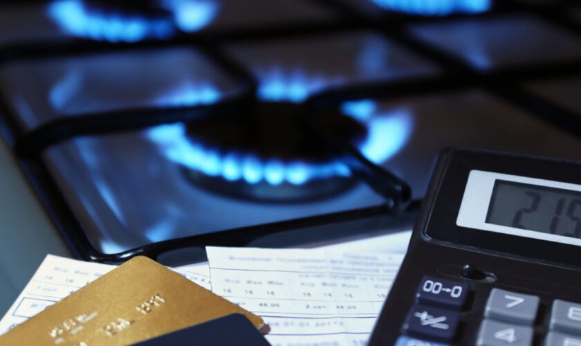 bank cards and a calculator on the background of a burning plate