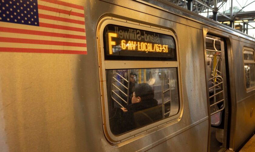 FILE - Commuters sit on the F train at the Coney Island-Stillwell Avenue Station, Thursday, Dec. 26, 2024, in New York. Pic: AP