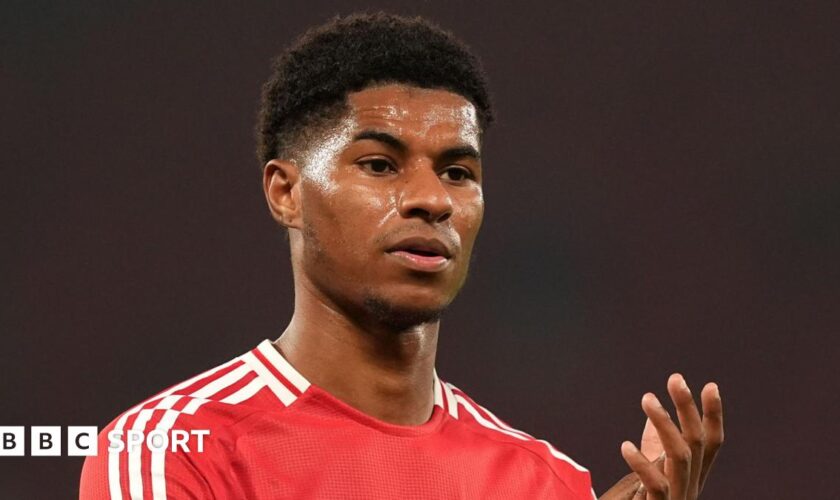 Manchester United forward Marcus Rashford claps fans