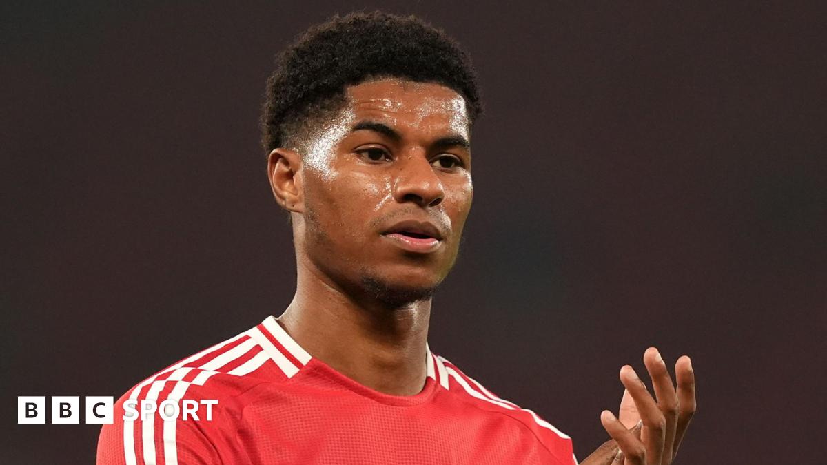 Manchester United forward Marcus Rashford claps fans