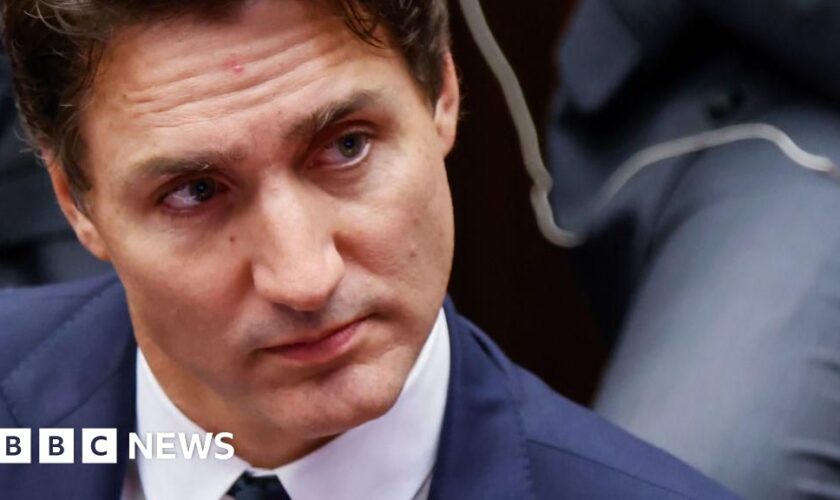 Faced with turmoil, a defiant Trudeau hangs on - for now