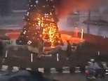 Fears for Christians in Syria as Christmas tree is burned down in first major sign the religious minority will be targeted after the fall of Assad - prompting protests in Damascus