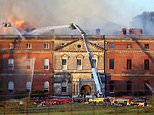 Grand plans to spend £63million on maintaining the fire-wrecked look for a Grade I listed mansion rather than restoring a 'great jewel of British architecture' is blasted as an 'act of barbarianism'