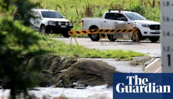 Heavy rain prompts evacuation alerts in Queensland as fires rage in Victoria