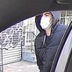 NYPD releases two NEW pictures of healthcare boss's assassin during his getaway in the back of a cab