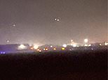 Shocking moment 'Putin's mystery drones' are spotted in the night sky over US airbase in Britain that is being lined up to house nuclear weapons