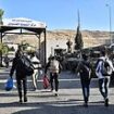 Six million Syrians who fled Assad's bloodthirsty regime begin to RETURN: Huge queues form as thousands battle to get back into the country as dictator is toppled and flees to Moscow 