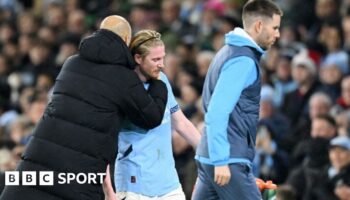 Manchester City's Kevin de Bruyne is hugged by manager Pep Guardiola after being substituted during the 3-0 win against Nottingham Forest