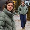 Suri Cruise cuts a casual figure in a khaki coat and cargo pants as she enjoys a stroll around New York City