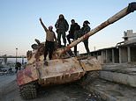 Syrian rebels 'take control of Aleppo' as Bashir al-Assad's forces collapse almost overnight while leader is out of the country