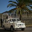 The Pontiff goes electric! Pope Francis makes first appearance in battery-powered 'G-Wagon popemobile' during trip to Corsica