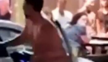 Wild moment naked man on 'rampage' sticks tongue out at stunned onlookers