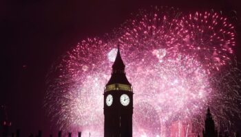 Revellers cheer in New Year around world despite bad weather forcing cancellations in UK