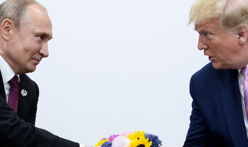 US President Donald Trump (R) attends a meeting with Russia's President Vladimir Putin during the G20 summit in Osaka on June 28, 2019.