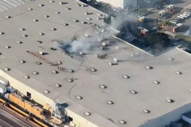 Plane crashes into huge warehouse with multiple 'casualties' reported