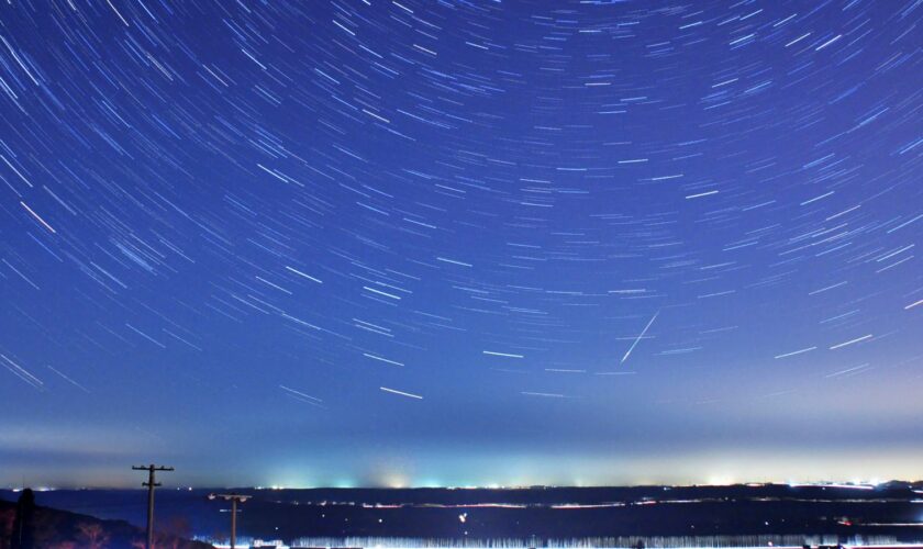 A meteor streaks past stars during the annual Quadrantid meteor shower in Qingdao, China