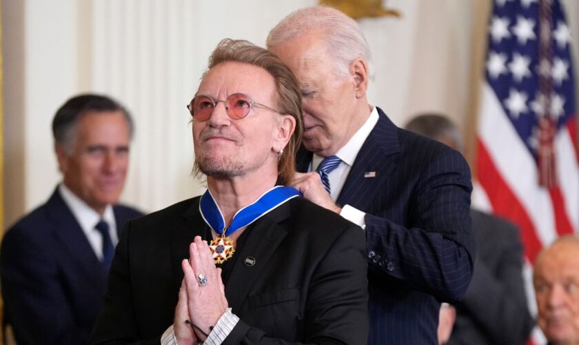 President Joe Biden presents Bono with the Presidential Medal of Freedom. Pic: AP