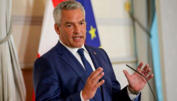 FILE - Austrian Chancellor Karl Nehammer attends a press conference in Vienna on Thursday, Aug. 8, 2024. (AP Photo/Heinz-Peter Bader, File)