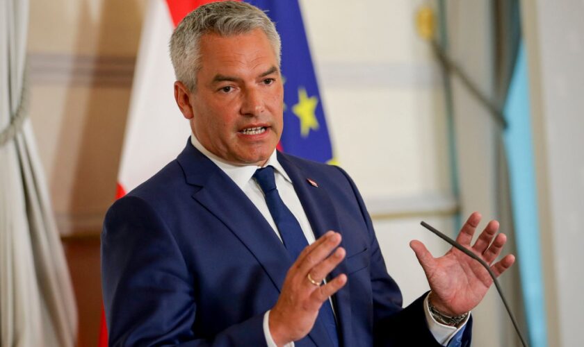 FILE - Austrian Chancellor Karl Nehammer attends a press conference in Vienna on Thursday, Aug. 8, 2024. (AP Photo/Heinz-Peter Bader, File)