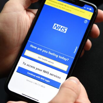 File photo dated 28/04/21 of a person holding a mobile phone displaying the NHS app. More NHS patients who need elective care will be able to decide where they are treated under new Government plans to slash waiting lists. Issue date: Sunday January 5, 2025.Kirsty O'Connor/PA Wire