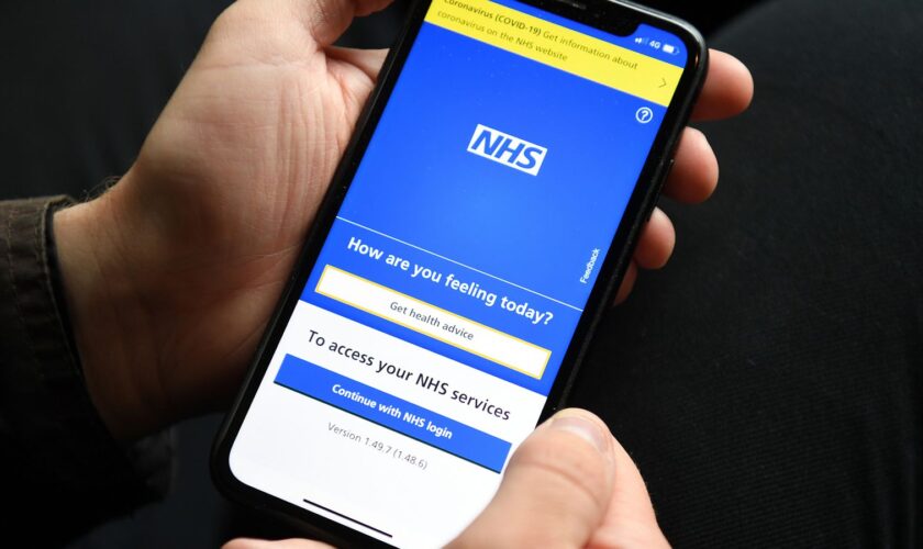 File photo dated 28/04/21 of a person holding a mobile phone displaying the NHS app. More NHS patients who need elective care will be able to decide where they are treated under new Government plans to slash waiting lists. Issue date: Sunday January 5, 2025.Kirsty O'Connor/PA Wire