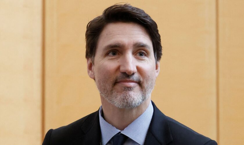 Canada's Prime Minister Justin Trudeau stands to leave after signing a book of condolences marking the passing of former U.S. President Jimmy Carter at the U.S. Embassy in Ottawa, Ontario, Canada January 3, 2025. REUTERS/Blair Gable