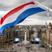 People gather as The Netherlands holds its annual World War II remembrance ceremony in Amsterdam with restricted public access and heightened security concerns, amid tensions over the war in Gaza, in Amsterdam, Netherlands, May 4 2024. REMKO DE WAAL/Pool via REUTERS