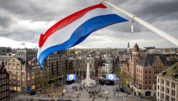 People gather as The Netherlands holds its annual World War II remembrance ceremony in Amsterdam with restricted public access and heightened security concerns, amid tensions over the war in Gaza, in Amsterdam, Netherlands, May 4 2024. REMKO DE WAAL/Pool via REUTERS