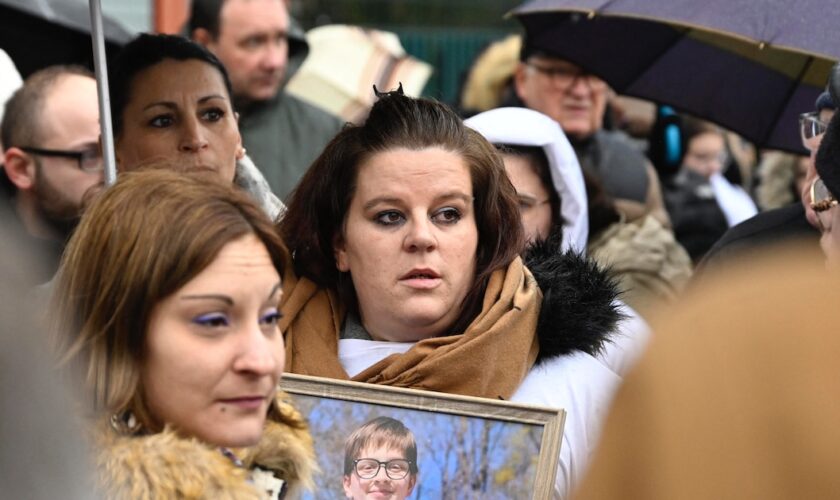 Severine (C), the mother of 13-year old Lucas, and relatives are pictured during a rally in his tribute following his suicide in Epinal, eastern France, on February 5, 2023. Severine (whose family name is not made available for privacy) said that the harassment and bullying suffered by his son at school because of his homosexuality had clearly been the "trigger" for his act. (Photo by Jean-Christophe Verhaegen / AFP)