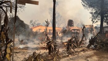 Truly apocalyptic: Flames swallowing homes and cars and lives wrapped up in a blanket of belongings