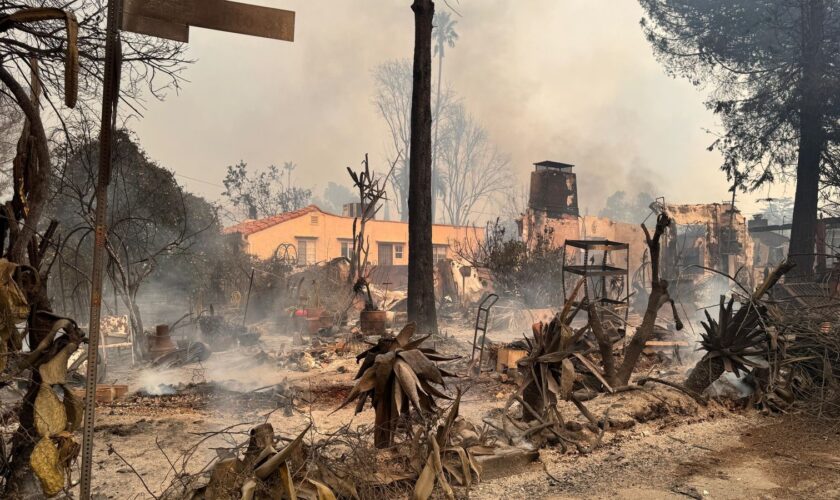 Truly apocalyptic: Flames swallowing homes and cars and lives wrapped up in a blanket of belongings