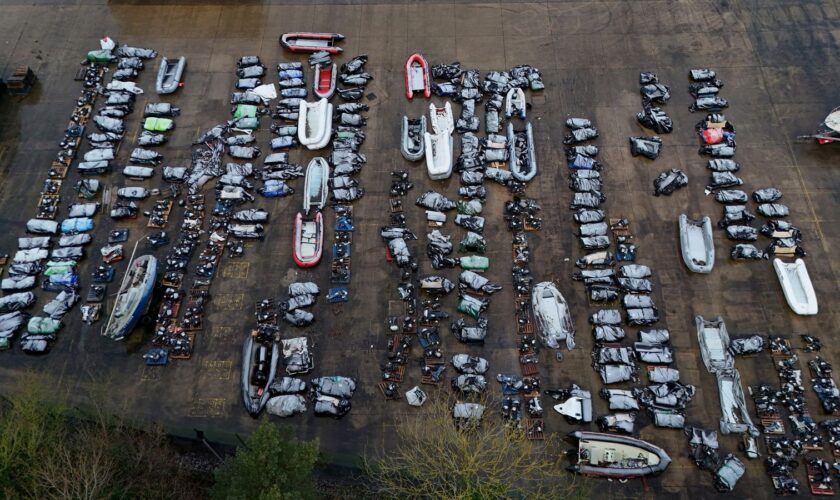 A view of confiscated small boats and outboard motors used to cross the Channel from France at a warehouse facility in Dover, Kent. The manufacturers of engines used on small boats to cross the Channel could be among those in line for financial sanctions under a new regime, the Foreign Secretary David Lammy has suggested, as plans are announced for new sanctions which will target the finances of people smuggling networks as part of efforts to stop migrants crossing the English Channel. Picture d