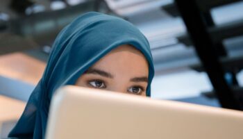 Arab businesswoman using a laptop