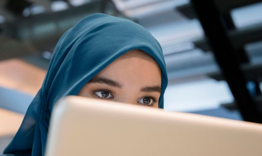 Arab businesswoman using a laptop