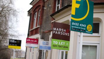 A row of letting agent signs placed outside houses. Around one in seven private renters in England have been hit by a rent hike in recent weeks, according to Shelter.