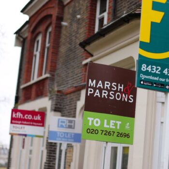 A row of letting agent signs placed outside houses. Around one in seven private renters in England have been hit by a rent hike in recent weeks, according to Shelter.