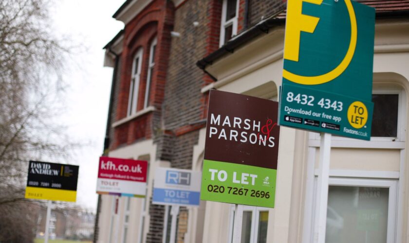 A row of letting agent signs placed outside houses. Around one in seven private renters in England have been hit by a rent hike in recent weeks, according to Shelter.