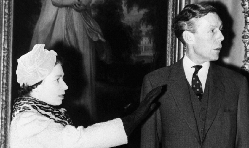 Professor Anthony Blunt with Queen Elizabeth II in 1970. Pic: PA