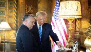 This handout photograph taken and released on March 8, 2024, by the Press Office of the Hungarian Prime Minister, shows Hungarian Prime Minister Viktor Orban (L) and former US President and Republican presidential candidate, Donald Trump during their meeting at Trump's Mar-a-Lago residence in Palm Beach, Florida. (Photo by ZOLTAN FISCHER / HUNGARIAN PRIME MINISTER'S OFFICE / AFP) / RESTRICTED TO EDITORIAL USE - MANDATORY CREDIT "AFP PHOTO / PRESS OFFICE OF THE HUNGARIAN PRIME MINISTER" - NO MARKETING NO ADVERTISING CAMPAIGNS - DISTRIBUTED AS A SERVICE TO CLIENTS