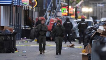 Emergency services attend the scene after a vehicle drove into a crowd on New Orleans' Canal and Bourbon Street, Wednesday Jan. 1, 2025. (AP Photo/Gerald Herbert)