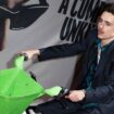 Timothee Chalamet rides an electronic bicycle upon arrival at the premiere of the film 'A Complete Unknown' in London, on Tuesday, Jan. 14, 2025. (Photo by Scott A Garfitt/Invision/AP)